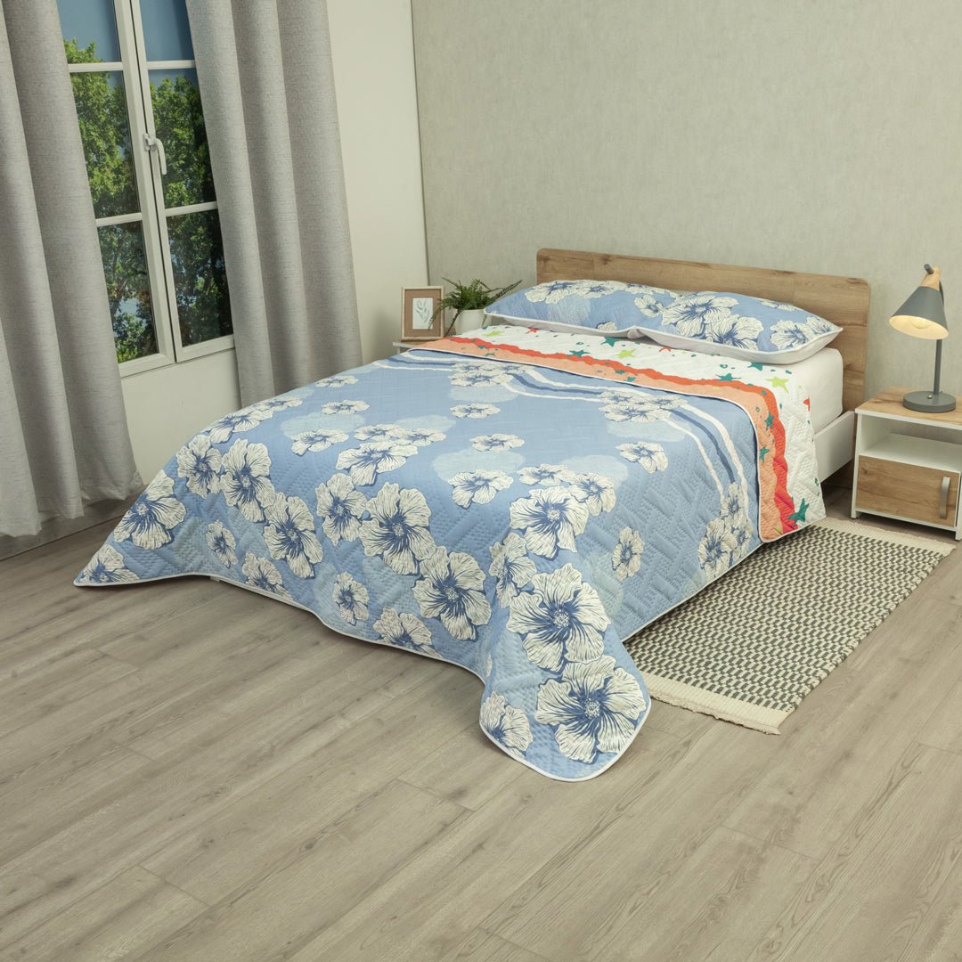 Cubrelecho Doble Faz Ecos de Cielo Naranja y Azul para Cama Doble 140 X 190 Cm Prensado de Estrellas Y Flores - TENDIDOS Y CUBRELECHOS | Bylmo